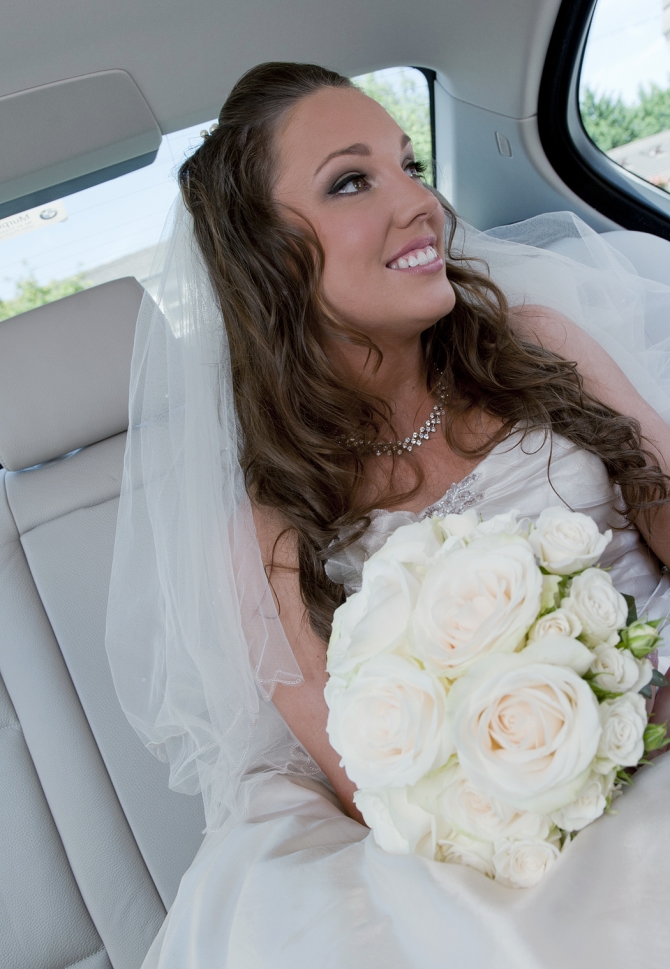 bride in wedding car