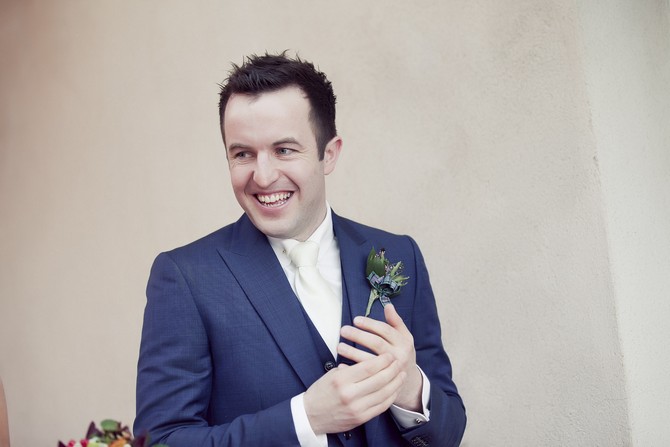 groom in navy suit 