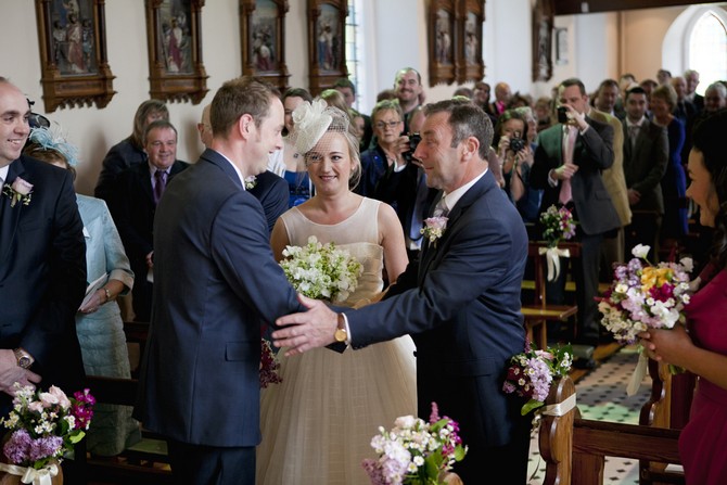father giving bride away