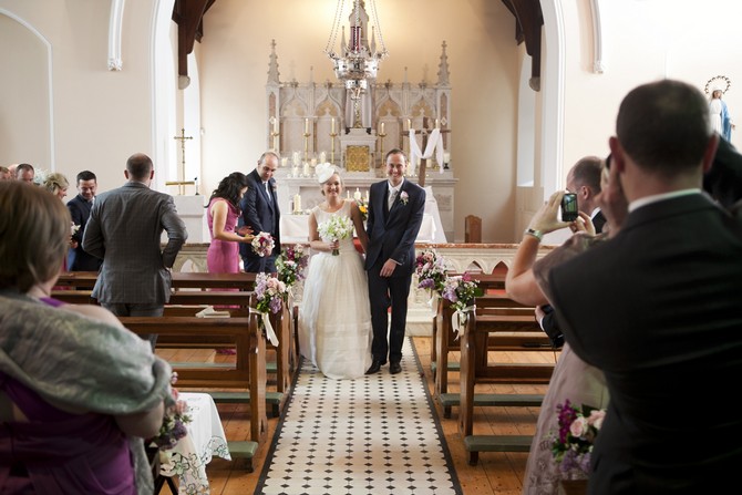 bride and groom walking down aisle