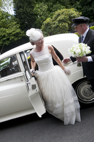 bride exiting car wedding